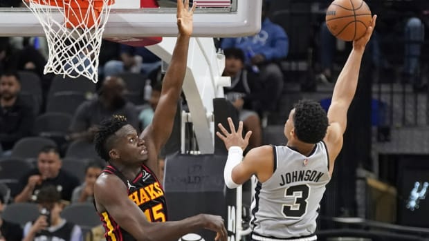 Nov 24, 2021; San Antonio, Texas, USA; San Antonio Spurs forward Keldon Johnson (3) shoots over Atlanta Hawks center Clint Capela (15) during the second half at AT&amp;T Center. Mandatory Credit: Scott Wachter-USA TODAY Sports